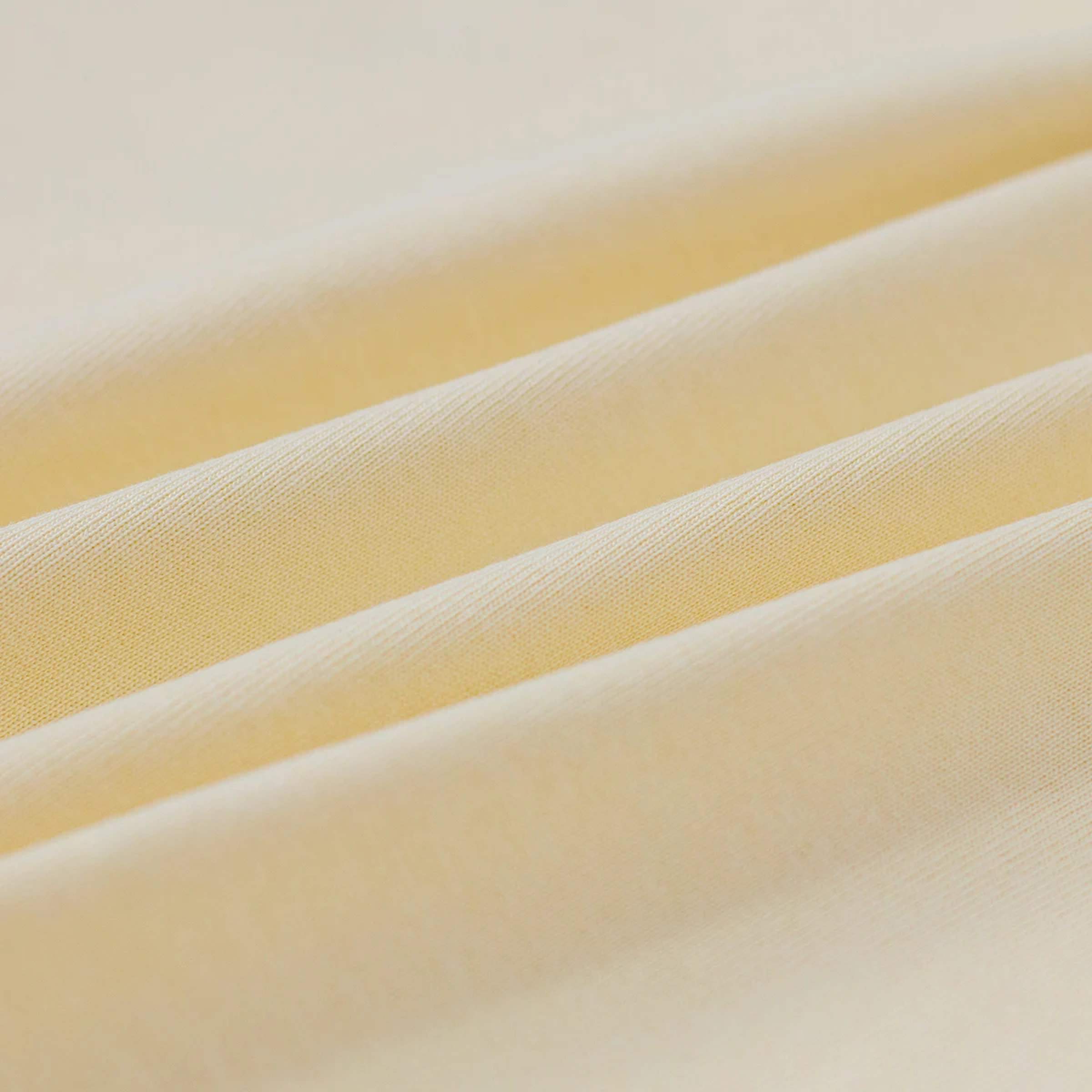 Close-up of yellow fabric with a soft texture