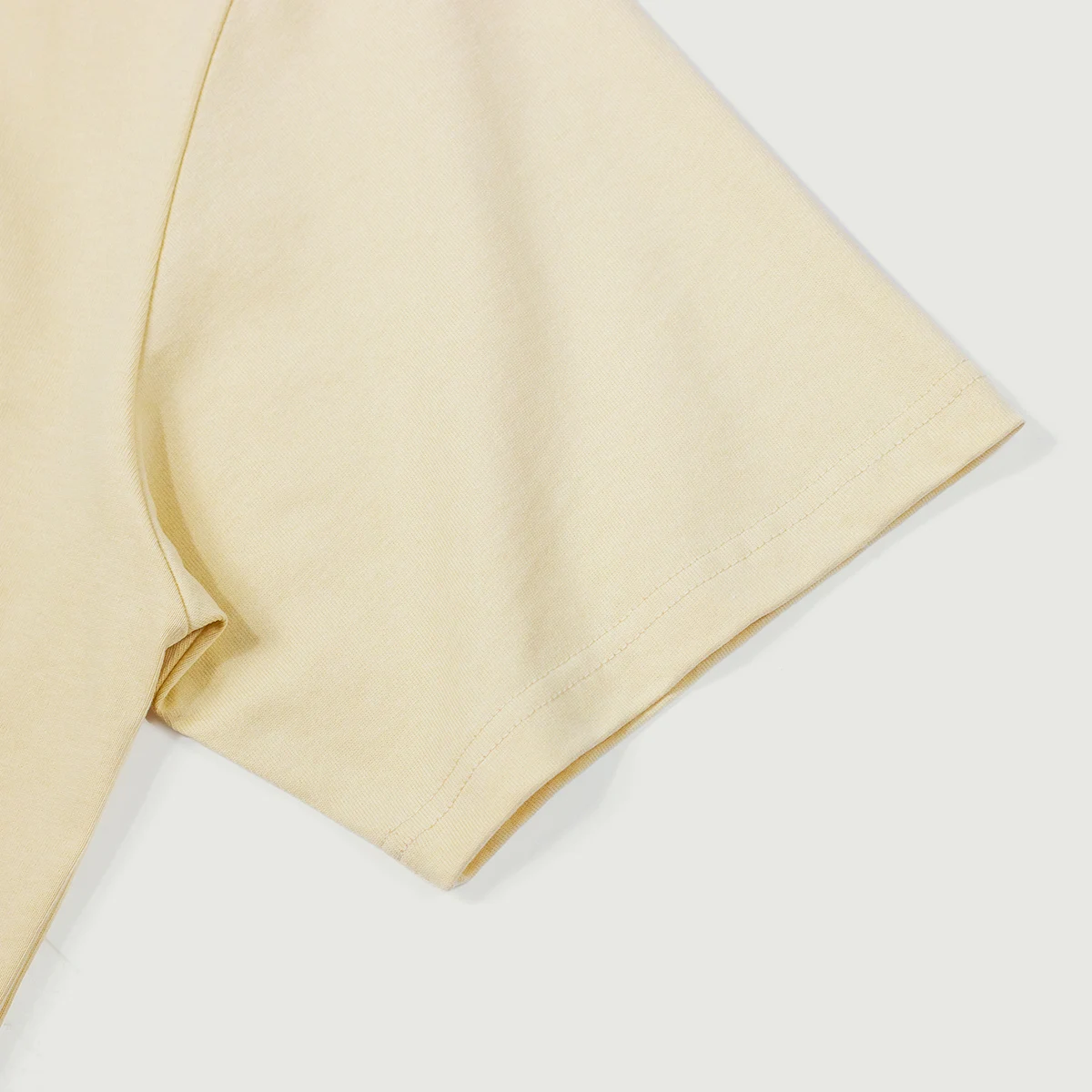 Yellow t-shirt  fabric on a white background sleeve details