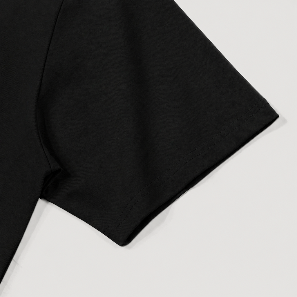Black fabric sleeve detail on a white background 