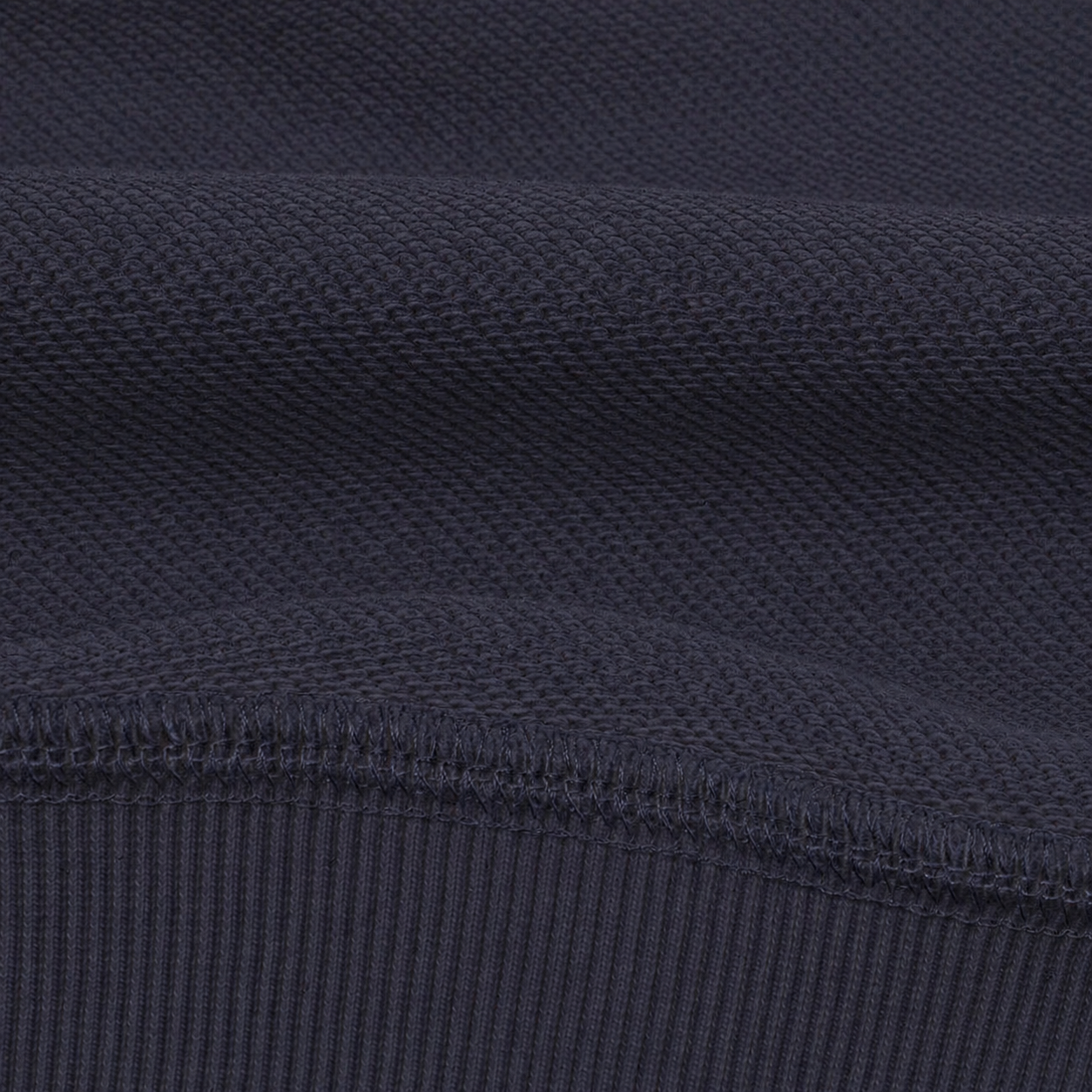 Close-up of dark blue fabric with a textured pattern