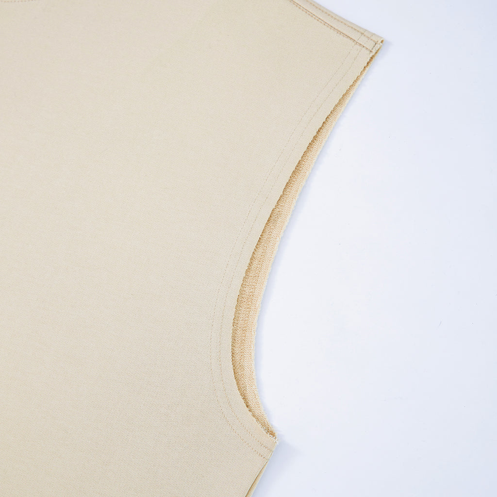 Uniform beige tank top sleeve corner on a white background