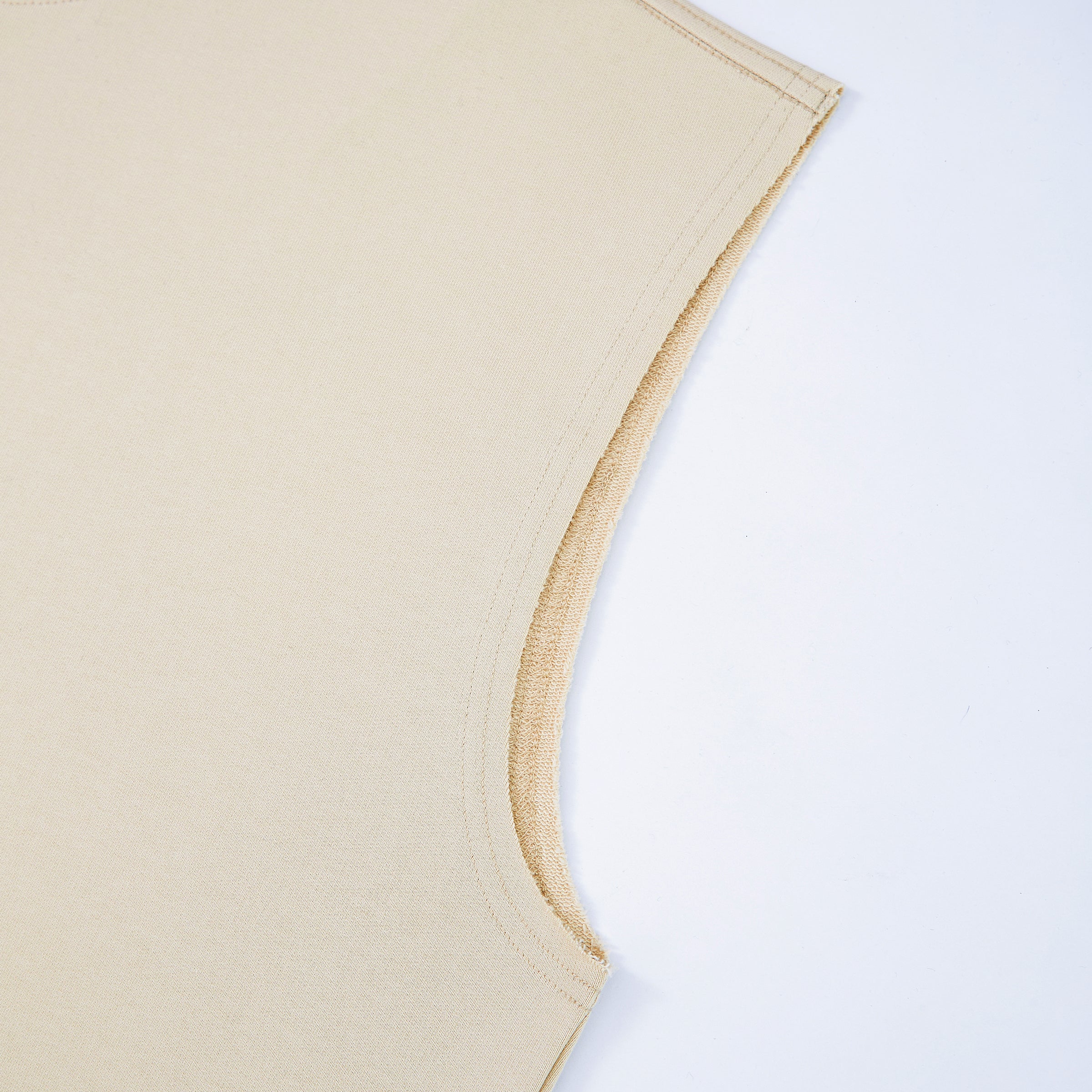 Uniform beige tank top sleeve corner on a white background